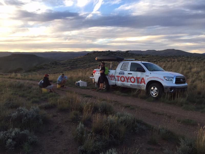 This is how trailwork ends: brats and cold beverages under big skies.